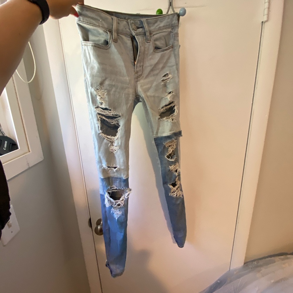 multicolored ripped American eagle jeans